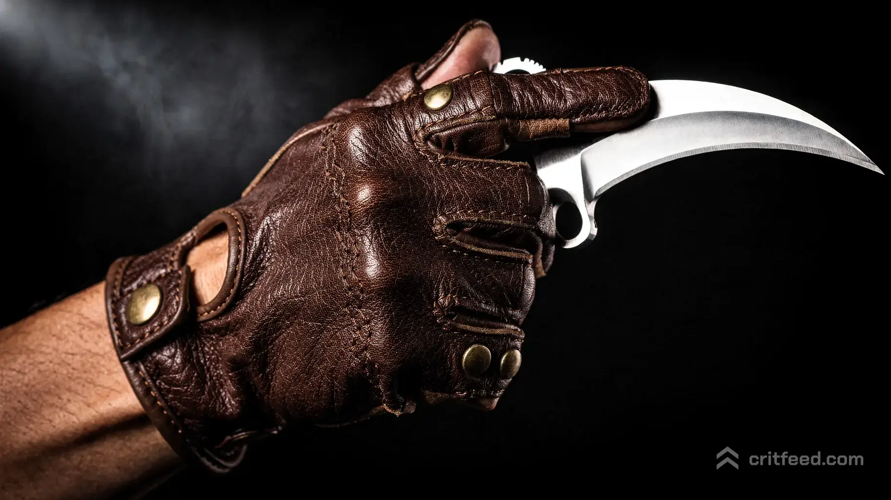 A close-up shot of a hand holding a vanilla Karambit knife in a reverse grip. The hand wears premium dark brown leather…