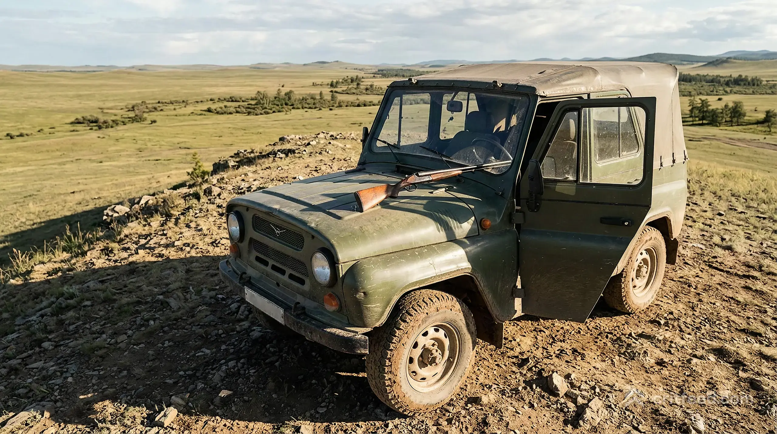 a dusty UAZ parked on a ridge above open grassland, the driver door hanging open, a shotgun resting across the dashboard,